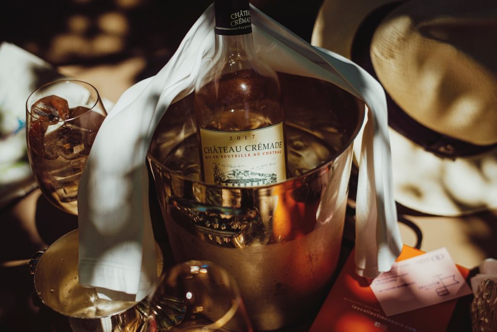 clear glass bottle on red table cloth